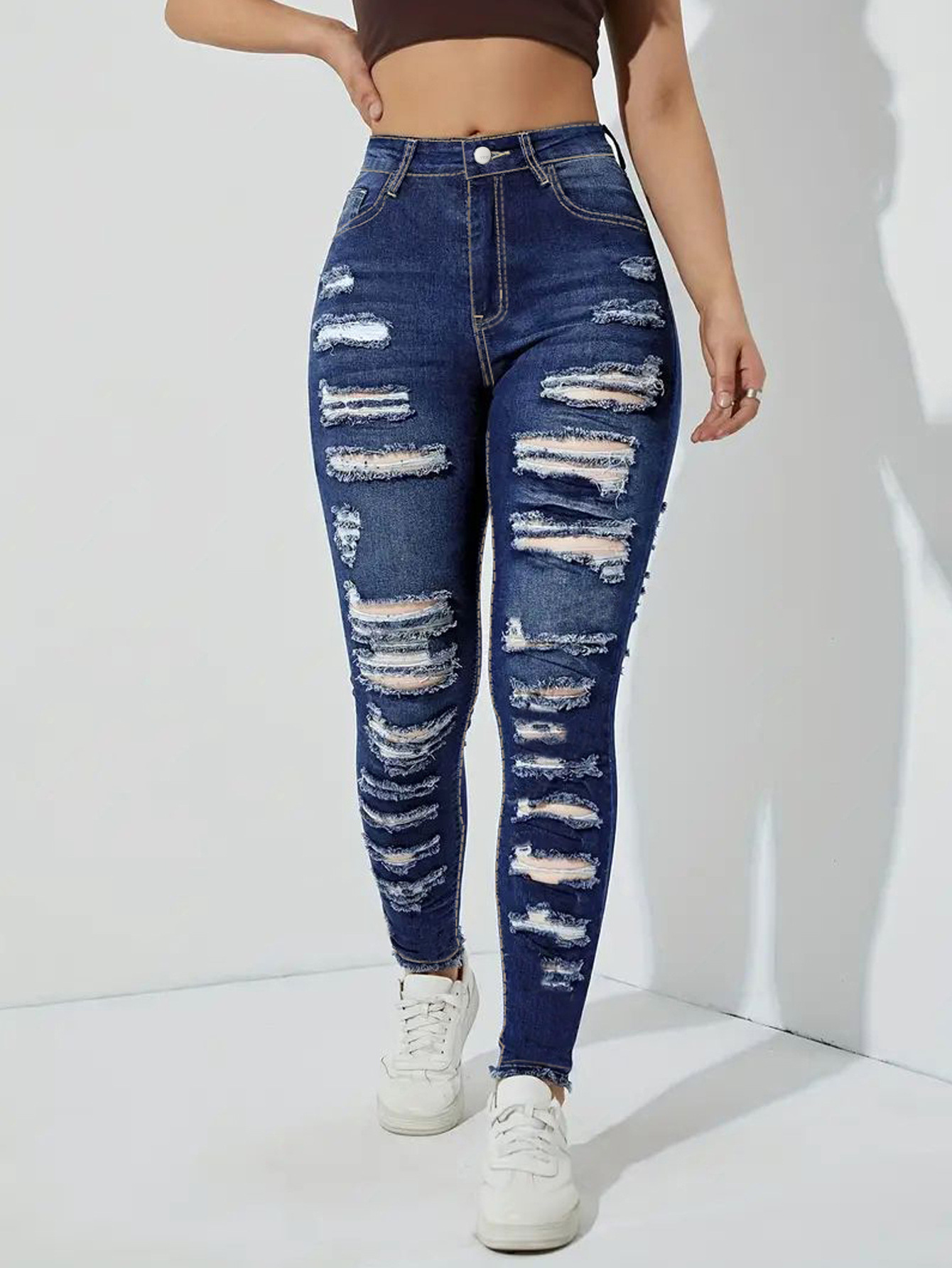 High Waist Distressed Skinny Jeans with Heavily Ripped Design